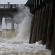 Waves crash along a pier in Panama City Beach.
